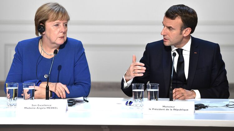 Ангела Меркель и Эммануэль Макрон на саммите в Париже. Фото сайта Кремля